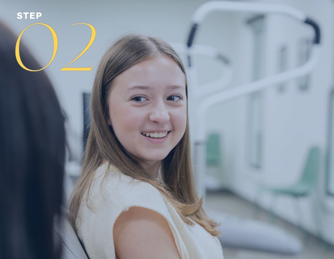 teen patient looking at orthodontic scans